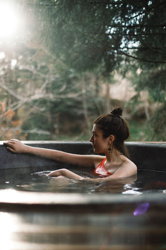 a woman sitting in a hot tub